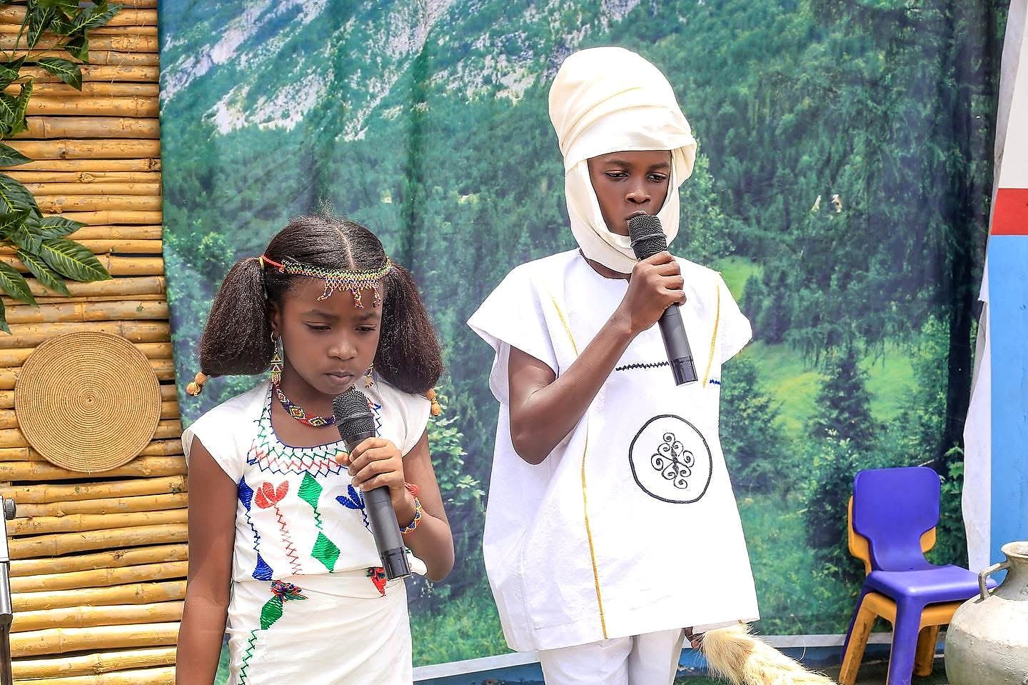 Students presenting on stage